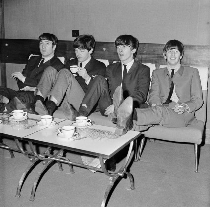 The Beatles relax backstage at London's Prince of Wales Theatre, before the Royal Variety Performance, 4th November 1963. They are supporting Marlene Dietrich in the show. (Photo by Mark and Colleen Hayward)