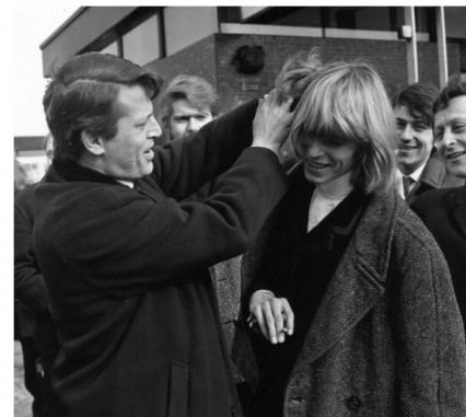 Bowie showing off his lovely long hair to Barry Langford 1965