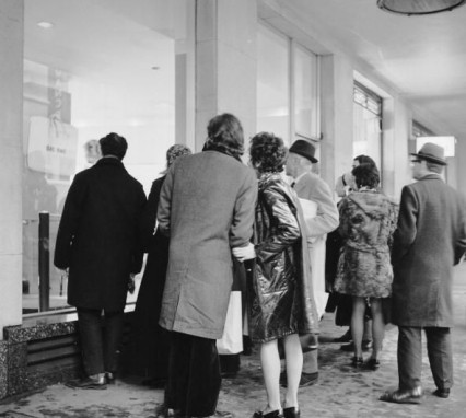 People looking at the Lennon exhibition at Eugene Schuster's London gallery in 1970