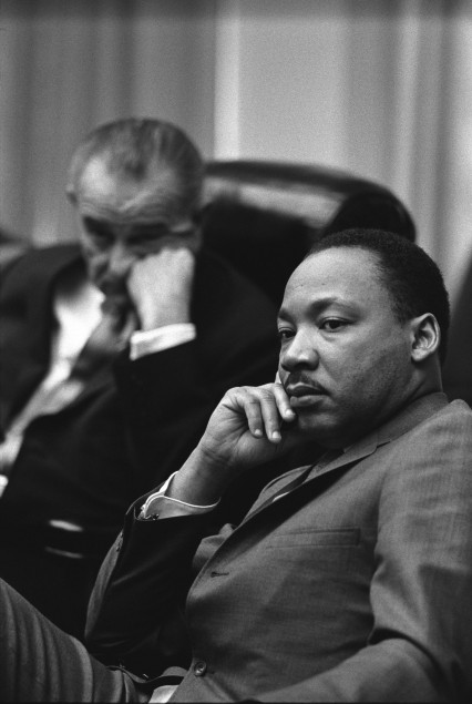 Martin Luther King with Lyndon Johnson in the background